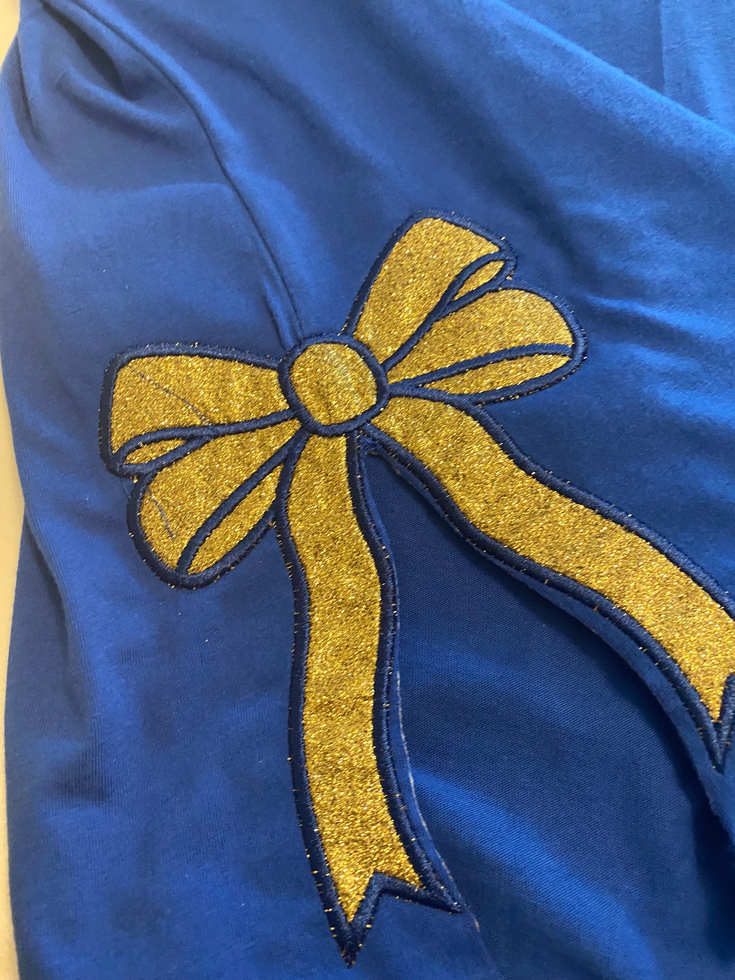 Sigma Gamma Rho Bella+Canvas Women’s Relaxed T-Shirt – 1922 Gold Bow Edition